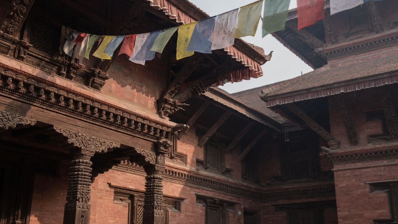 Carved Newari courtyard with prayer flags, Kathmandu Valley